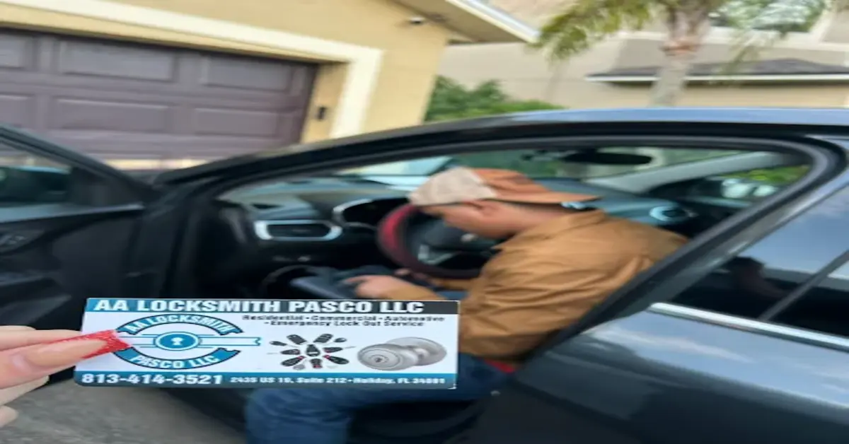AA Locksmith Pasco LLC automotive locksmith service in action. A professional locksmith is helping a customer with a car lockout. The image shows a locksmith's business card with the company details, emphasizing the benefits of hiring an automotive locksmith for emergency lockout services